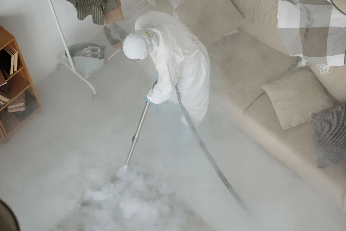 Biohazard cleanup technician in protective equipment, Fairplay, CO